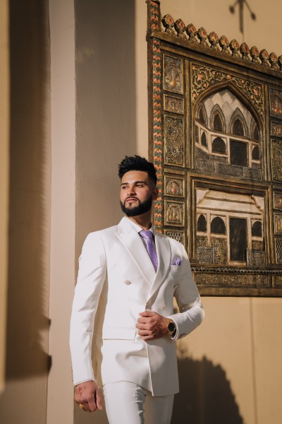 Groom getting ready photography in New York by Citi Events Productions, capturing a stylish wedding moment with natural emotion.