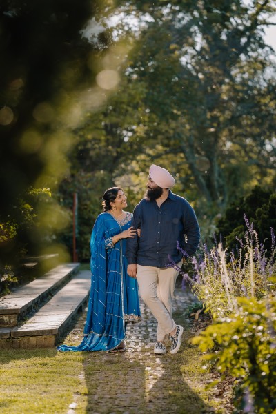 Sikh couple enjoying a romantic pre-wedding photoshoot in New York with cinematic light, candid emotion, and timeless style.